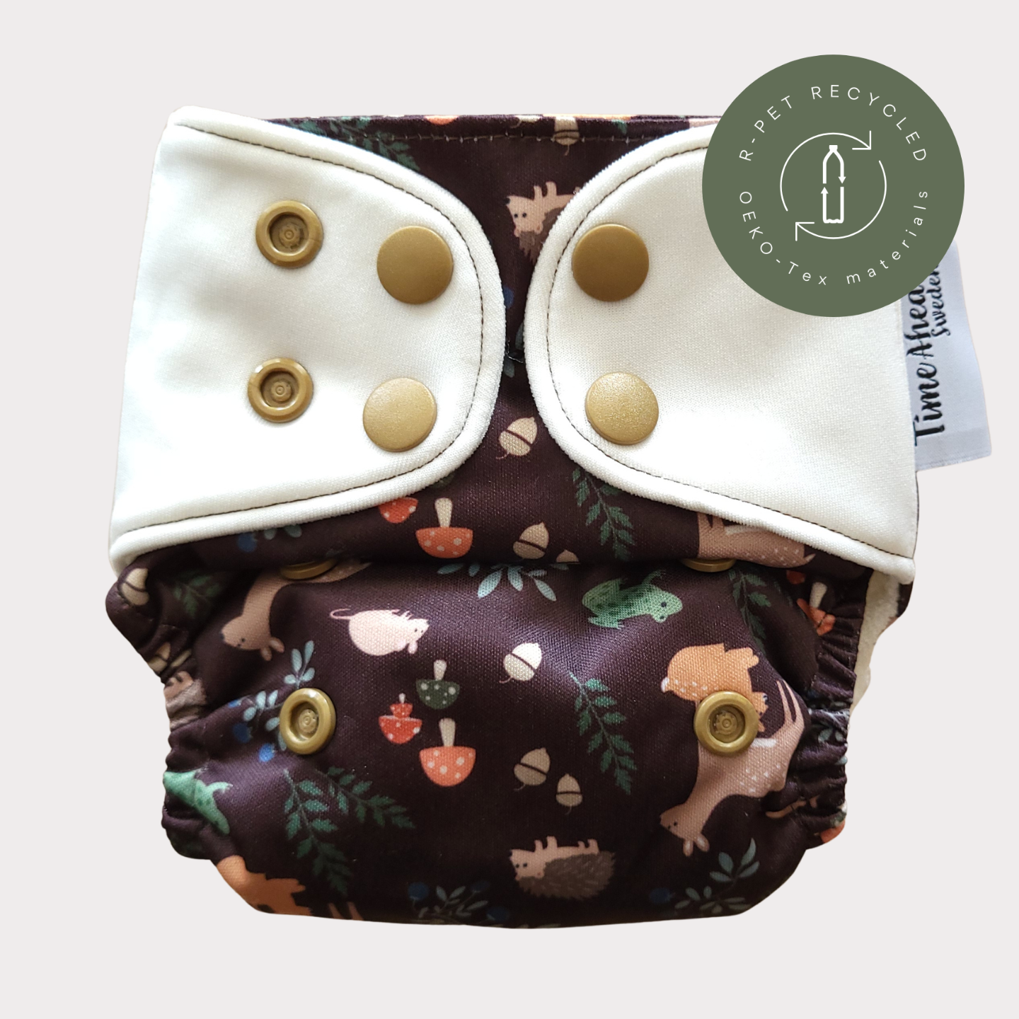 Cloth Nappy Newborn all-in-one 2–6 kg in the Skogsvrå pattern, shown from the front with white snap tabs.
