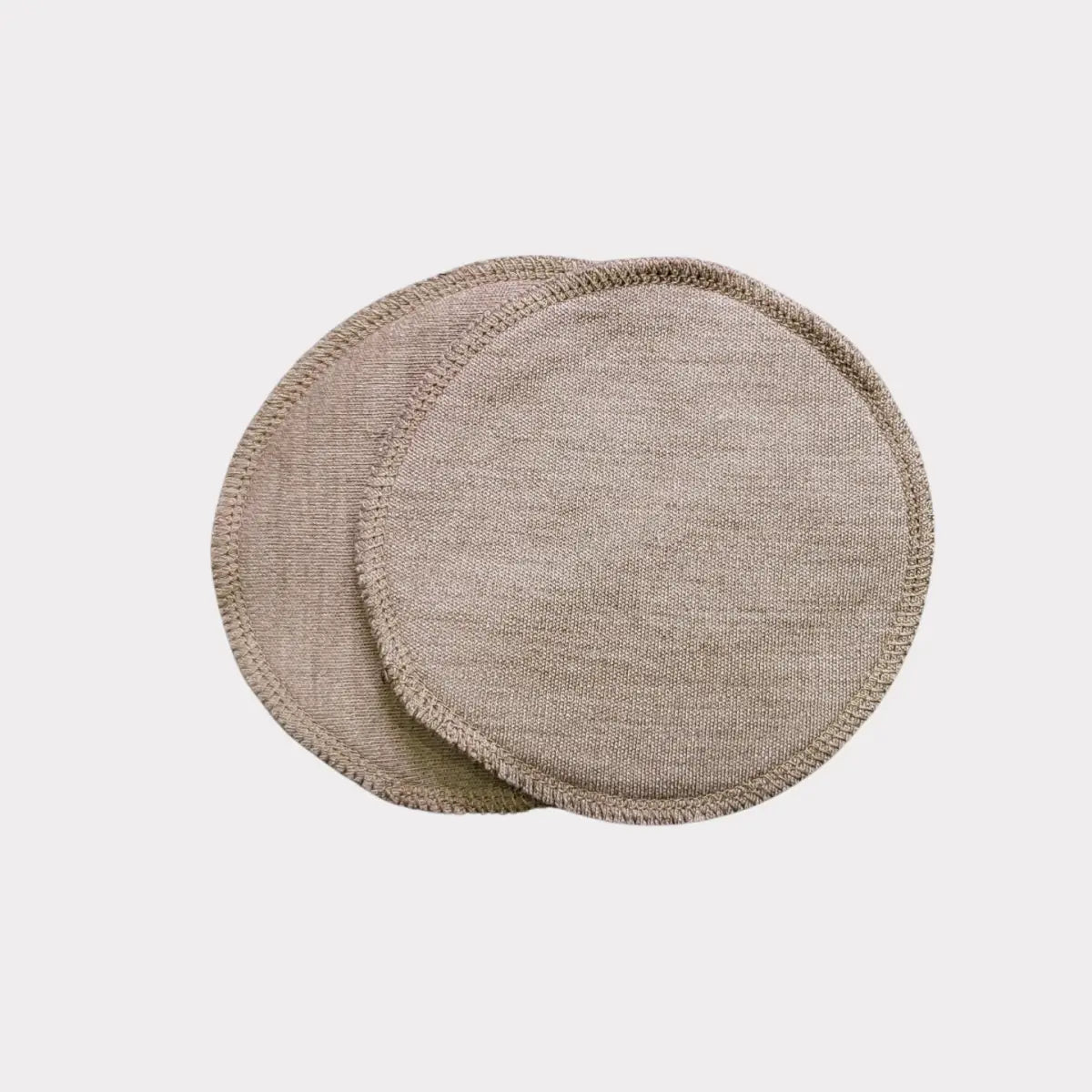 Beige rund underläggsset med 2 st, texturerat linne material med naturlig kantfinish.