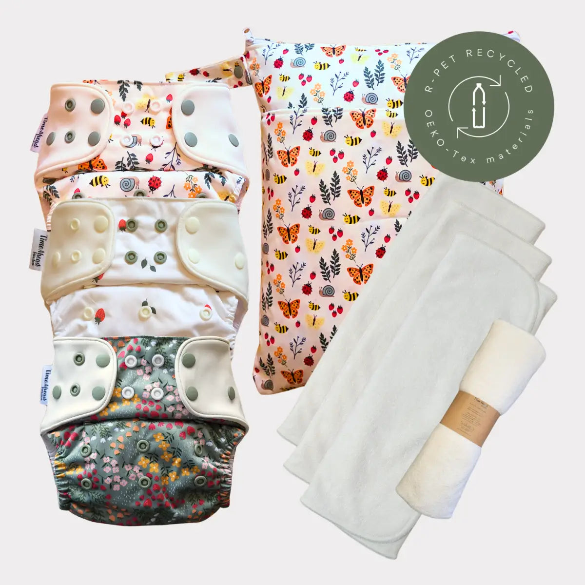 Startpaket komfort med fyra återanvändbara pocketblöjor i mjuk bambufrotté med floral design och lagringsväska